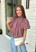 Sweet gingham and thoughtful details make this blouse an instant favorite for the season. Featuring a charming pink and brown gingham print, this lightweight top brings a fresh, feminine touch to your fall wardrobe. The mock neckline with a tie detail at the neck, puff sleeves, and bubble hem create a flattering silhouette that's both polished and comfortable. 