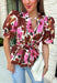 A beautiful floral blouse is one of those pieces you'll reach for all season long, and this one is full of thoughtful details you'll love! Designed with a soft neutral background, this feminine top is adorned with rich brown and pink florals accented by subtle pops of black for the perfect autumn-inspired palette. The flattering self-tie waist creates a customizable silhouette, while the smocked back offers a comfortable fit that moves with you throughout the day.