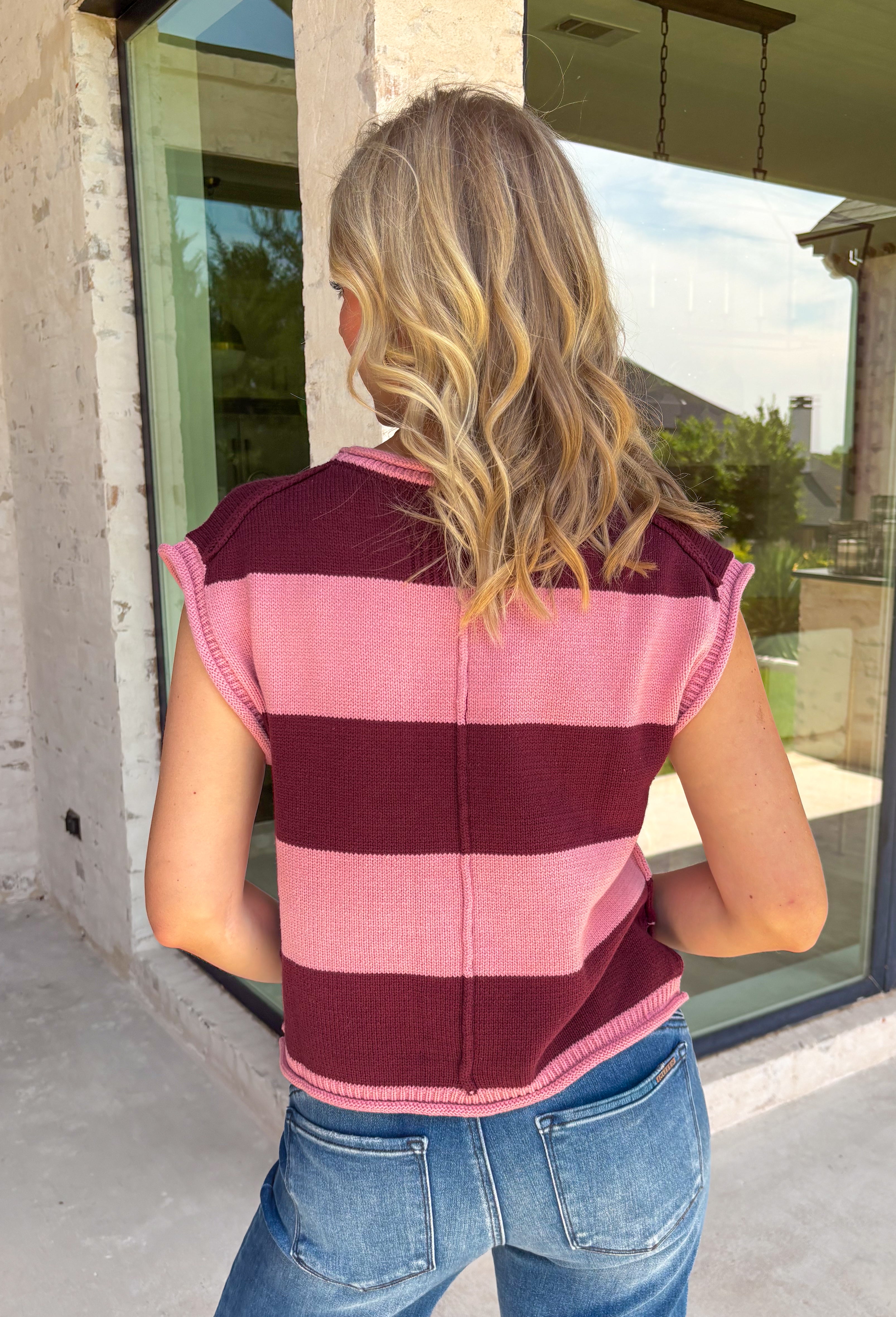 Bring rich autumn color to your everyday wardrobe with this effortlessly stylish striped knit sleeveless sweater. Featuring timeless burgundy and mauve stripes with contrast trim detailing, this sweater knit is the perfect blend of classic and cozy. The cap sleeves and lightweight feel make it easy to wear on its own during warmer fall days or layered under your favorite jacket as the season cools.
