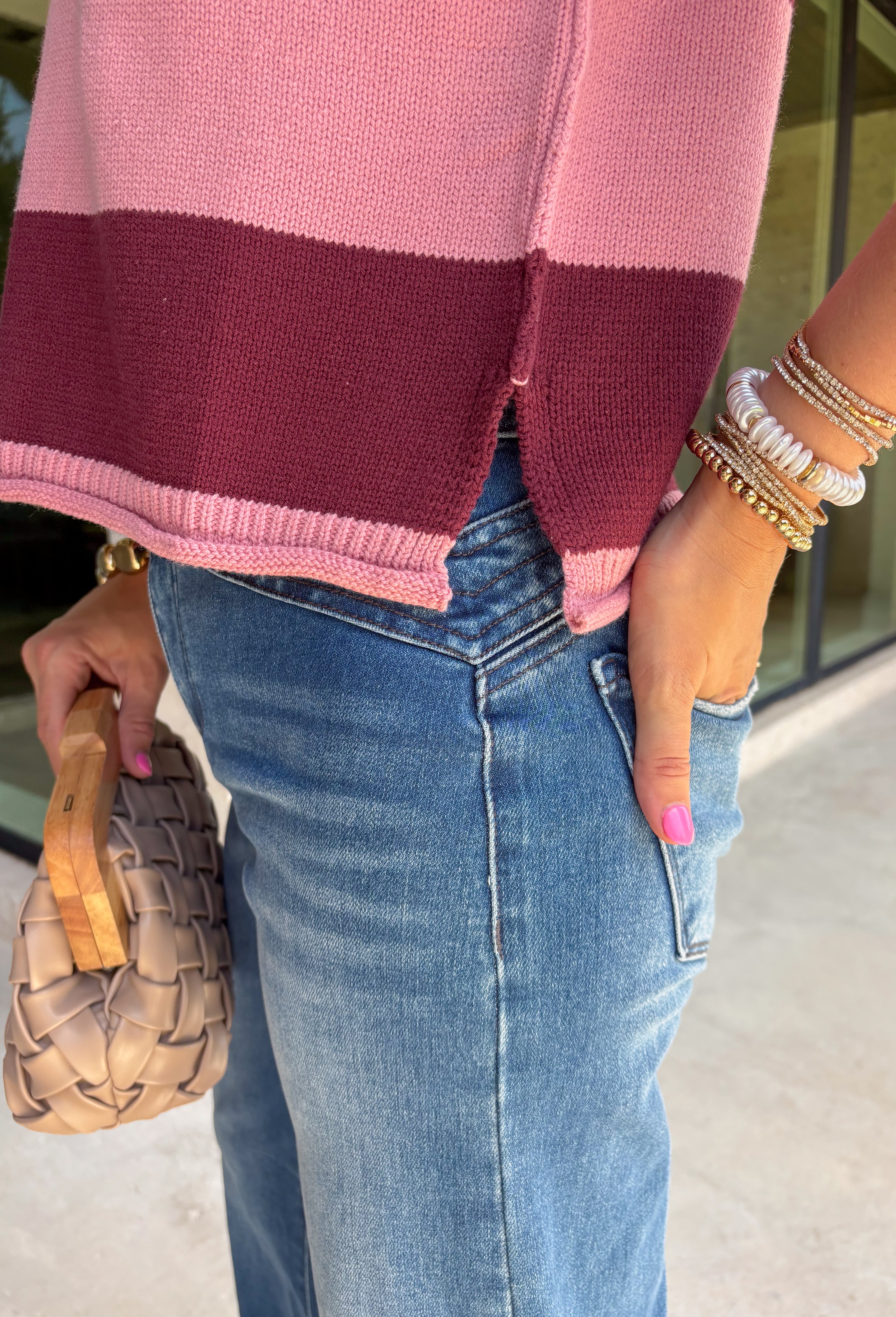 Bring rich autumn color to your everyday wardrobe with this effortlessly stylish striped knit sleeveless sweater. Featuring timeless burgundy and mauve stripes with contrast trim detailing, this sweater knit is the perfect blend of classic and cozy. The cap sleeves and lightweight feel make it easy to wear on its own during warmer fall days or layered under your favorite jacket as the season cools.