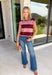 Bring rich autumn color to your everyday wardrobe with this effortlessly stylish striped knit sleeveless sweater. Featuring timeless burgundy and mauve stripes with contrast trim detailing, this sweater knit is the perfect blend of classic and cozy. The cap sleeves and lightweight feel make it easy to wear on its own during warmer fall days or layered under your favorite jacket as the season cools.