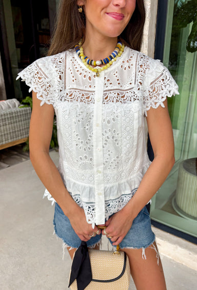 This white floral eyelet lace top is the definition of a timeless summer staple! The delicate eyelet detail adds beautiful texture, while the button down design keeps it classic and easy to style. Lightweight and breathable in 100% cotton, it’s perfect for warm days when you want to feel polished without overthinking it. Whether you're heading to brunch, work, or a casual outing, this top pairs effortlessly with everything from denim shorts to skirts. 