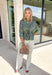 Fresh colors and flattering details make this striped blouse an easy favorite for the season. Designed with soft mint and brown stripes, this effortlessly polished top features a classic v-neckline and button-front design for timeless appeal. The adjustable drawstring waist creates a flattering, customizable fit, while the ¾-length sleeves with button cuffs add a refined finishing touch. Crafted from breathable cotton, this versatile blouse transitions seamlessly from workdays to weekend outings.