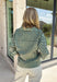 Fresh colors and flattering details make this striped blouse an easy favorite for the season. Designed with soft mint and brown stripes, this effortlessly polished top features a classic v-neckline and button-front design for timeless appeal. The adjustable drawstring waist creates a flattering, customizable fit, while the ¾-length sleeves with button cuffs add a refined finishing touch. Crafted from breathable cotton, this versatile blouse transitions seamlessly from workdays to weekend outings.