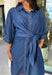 A timeless denim dress is always in style, and this lightweight beauty from Entro is one you'll wear on repeat. Crafted from soft medium wash tencel denim, this effortlessly flattering dress features a classic button-front design, a feminine v-neckline, and a matching self-tie waist that creates the perfect customizable fit. The ¾ length sleeves with button cuffs add a polished touch, while side pockets make it as practical as it is stylish. 