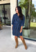 A timeless denim dress is always in style, and this lightweight beauty from Entro is one you'll wear on repeat. Crafted from soft medium wash tencel denim, this effortlessly flattering dress features a classic button-front design, a feminine v-neckline, and a matching self-tie waist that creates the perfect customizable fit. The ¾ length sleeves with button cuffs add a polished touch, while side pockets make it as practical as it is stylish. 