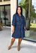 A timeless denim dress is always in style, and this lightweight beauty from Entro is one you'll wear on repeat. Crafted from soft medium wash tencel denim, this effortlessly flattering dress features a classic button-front design, a feminine v-neckline, and a matching self-tie waist that creates the perfect customizable fit. The ¾ length sleeves with button cuffs add a polished touch, while side pockets make it as practical as it is stylish. 