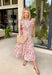 This neutral floral midi dress is such a soft, feminine favorite for summer! The pink floral print with hints of blue and green adds the prettiest pop of color while still feeling easy and wearable for any occasion. The smocked waist creates a flattering, comfortable fit, and the ruffle sleeves add that extra touch of charm. Finished with a v-neckline, side pockets, and a fully lined design, it’s as functional as it is pretty. Perfect for any warm weather special occasion—just add sandals and go. 