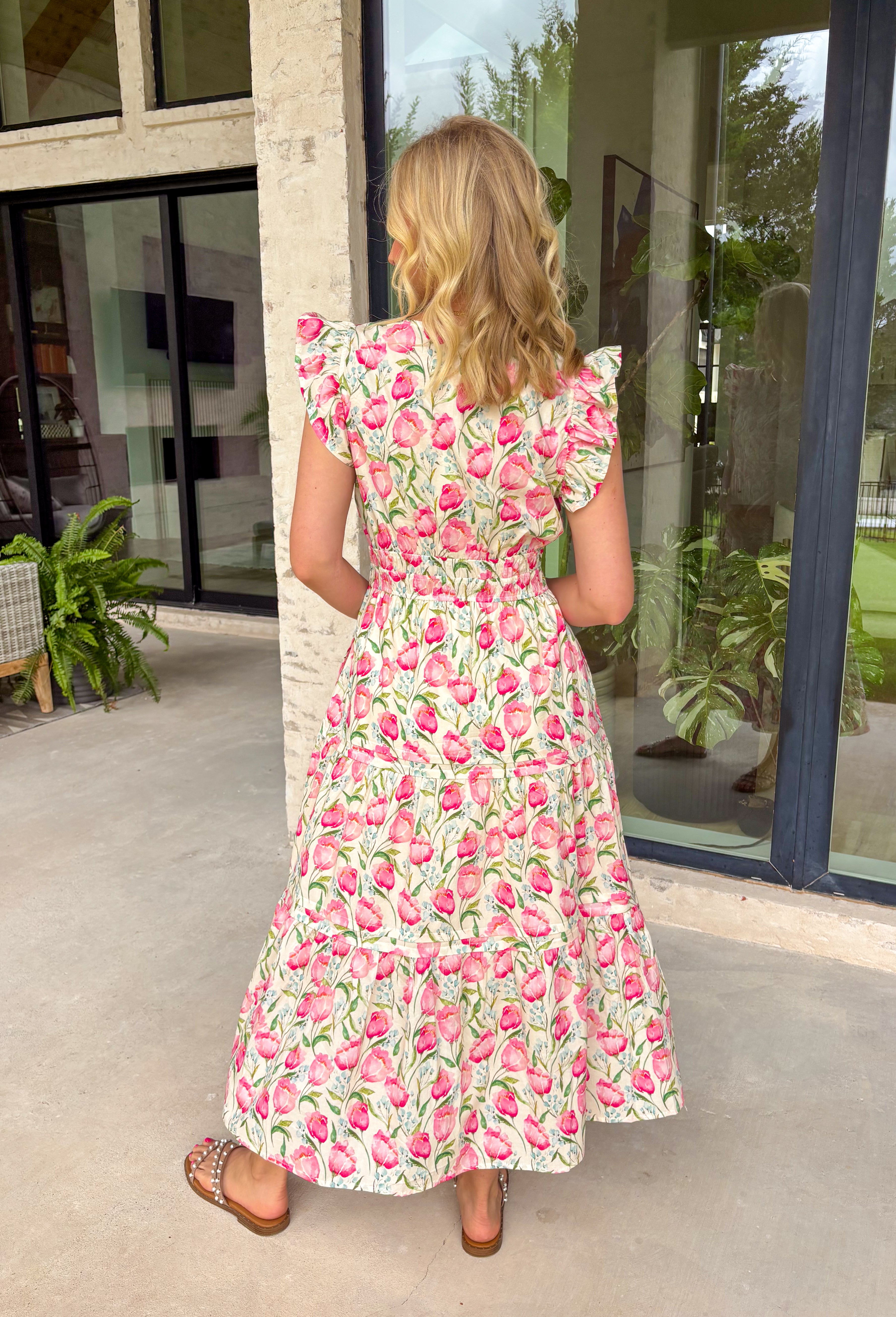 This neutral floral midi dress is such a soft, feminine favorite for summer! The pink floral print with hints of blue and green adds the prettiest pop of color while still feeling easy and wearable for any occasion. The smocked waist creates a flattering, comfortable fit, and the ruffle sleeves add that extra touch of charm. Finished with a v-neckline, side pockets, and a fully lined design, it’s as functional as it is pretty. Perfect for any warm weather special occasion—just add sandals and go. 
