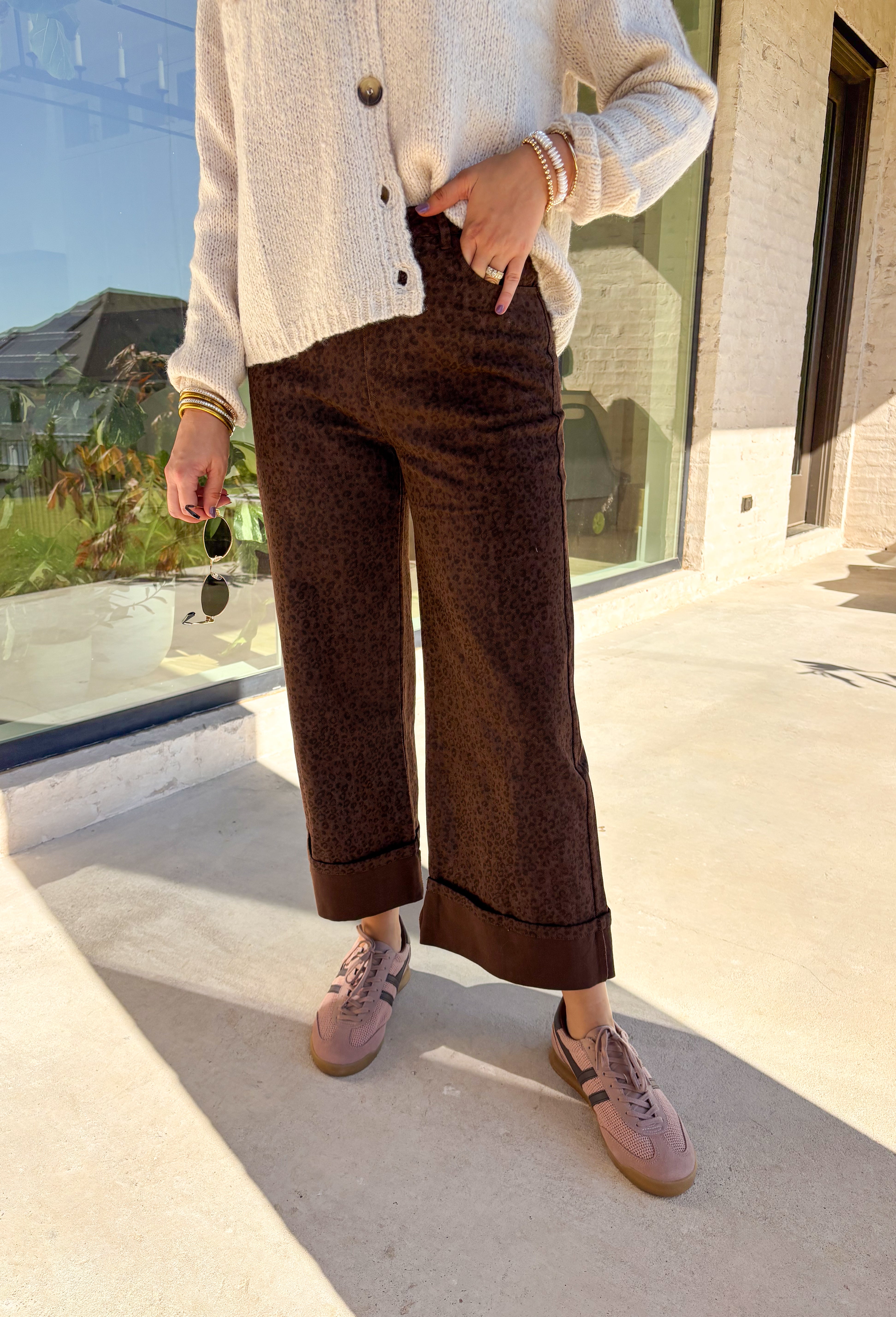 Go bold this fall with these high-waisted wide leg pants in a statement leopard print. The front patch pockets and cuffed hem give them a casual-cool vibe, while the wide leg fit keeps them modern and flattering. Finished with a zip fly and button closure, these pants blend function with a playful edge. Made from a soft cotton-viscose blend, they’re comfortable enough for all-day wear yet chic enough to dress up for evening plans.