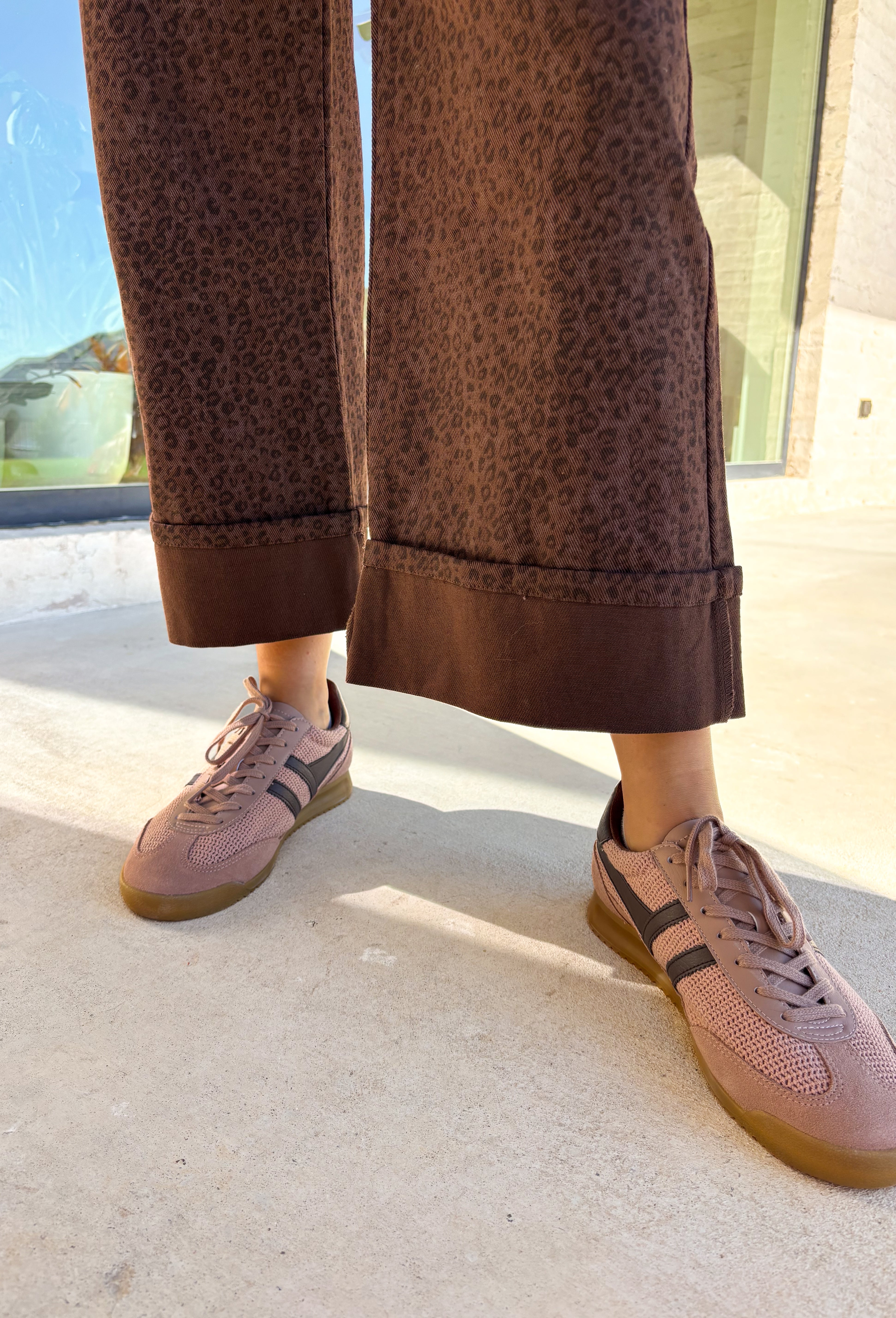 Go bold this fall with these high-waisted wide leg pants in a statement leopard print. The front patch pockets and cuffed hem give them a casual-cool vibe, while the wide leg fit keeps them modern and flattering. Finished with a zip fly and button closure, these pants blend function with a playful edge. Made from a soft cotton-viscose blend, they’re comfortable enough for all-day wear yet chic enough to dress up for evening plans.