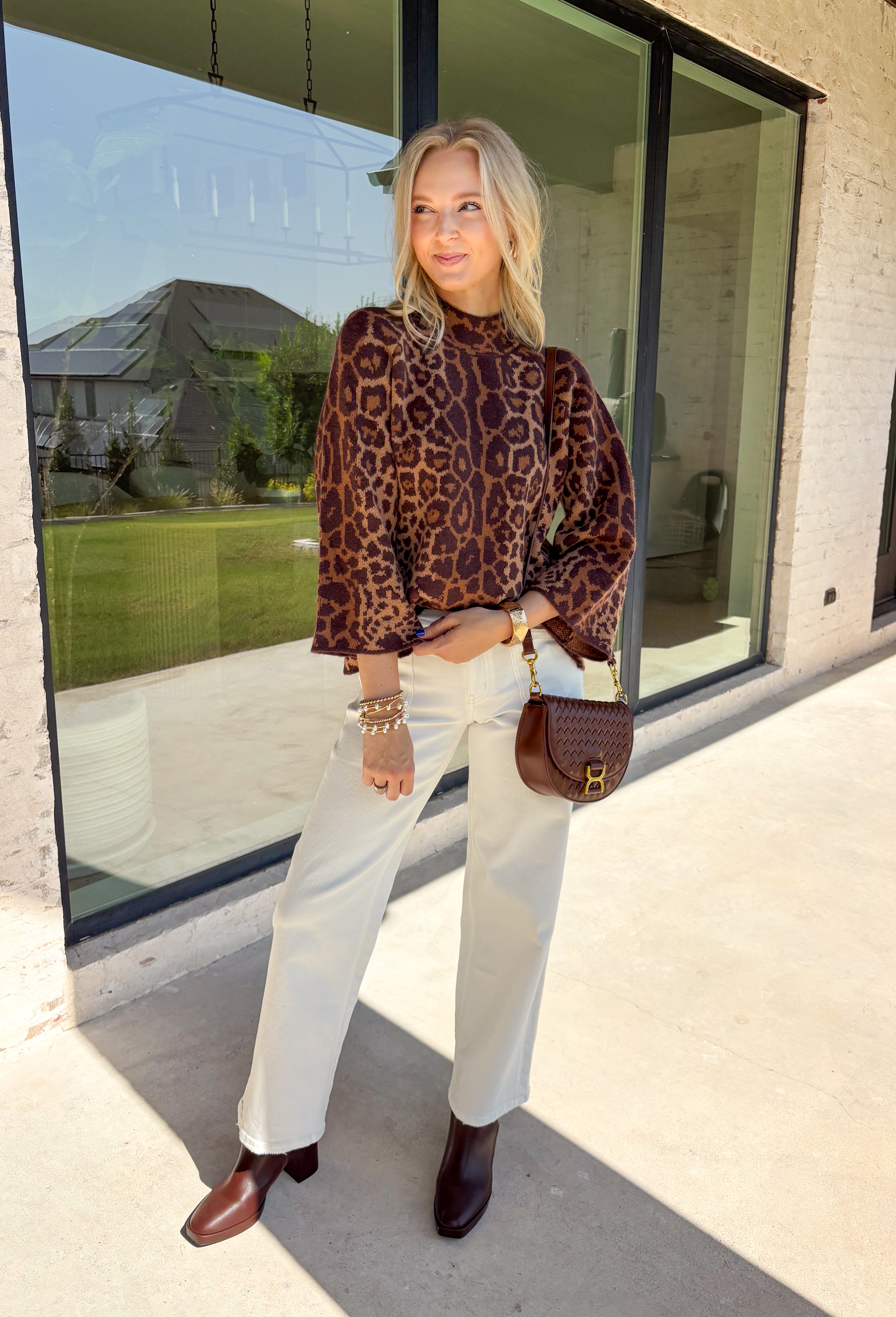 A timeless leopard print never goes out of style, and this cozy sweater is one you'll be reaching for all season long. Designed with a classic leopard pattern and an effortlessly chic mock neckline, this sweater combines bold style with everyday comfort. The ultra-soft knit feels cozy without being too heavy, making it perfect for layering through the cooler months. 