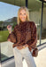 A timeless leopard print never goes out of style, and this cozy sweater is one you'll be reaching for all season long. Designed with a classic leopard pattern and an effortlessly chic mock neckline, this sweater combines bold style with everyday comfort. The ultra-soft knit feels cozy without being too heavy, making it perfect for layering through the cooler months. 