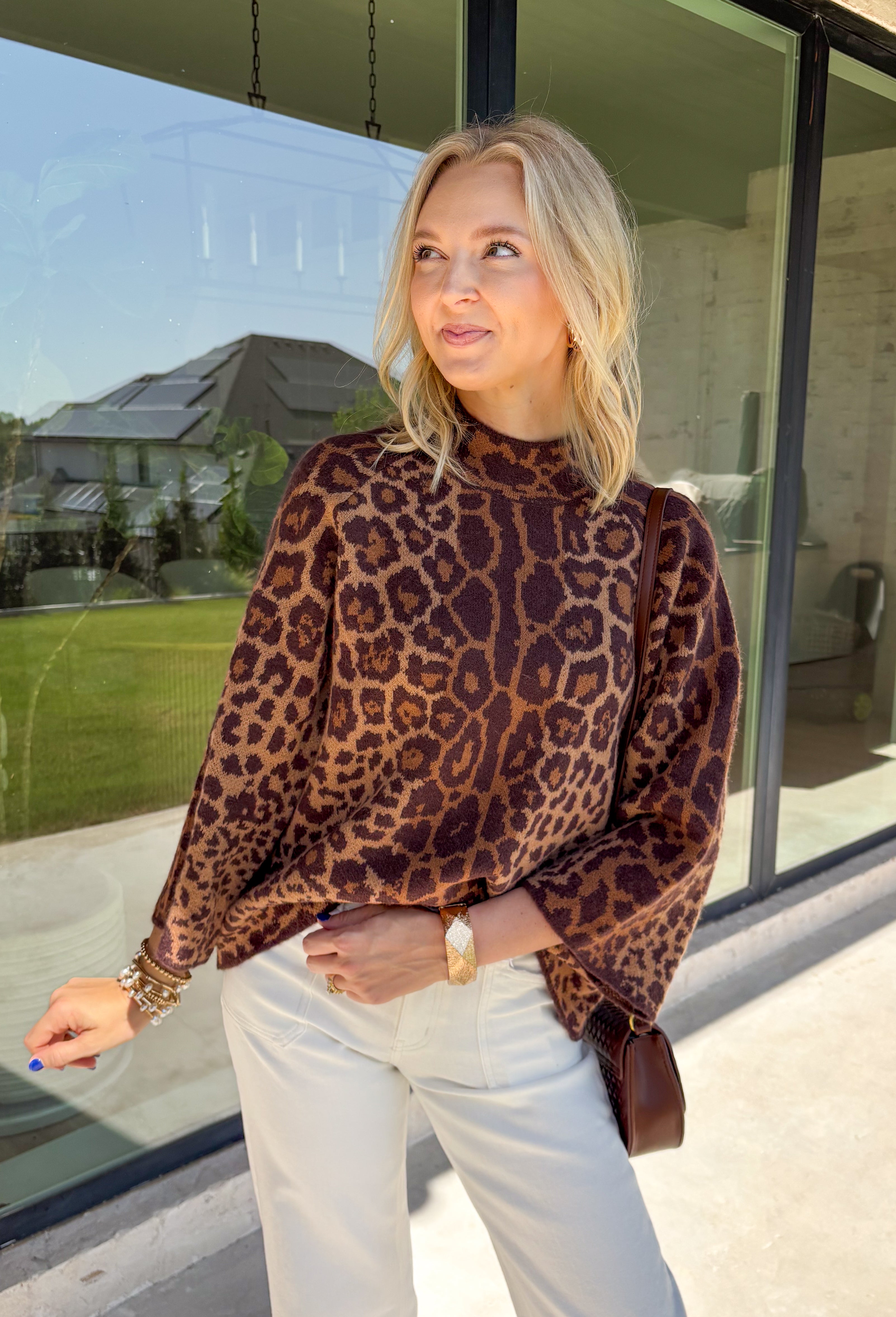 A timeless leopard print never goes out of style, and this cozy sweater is one you'll be reaching for all season long. Designed with a classic leopard pattern and an effortlessly chic mock neckline, this sweater combines bold style with everyday comfort. The ultra-soft knit feels cozy without being too heavy, making it perfect for layering through the cooler months. 