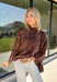 A timeless leopard print never goes out of style, and this cozy sweater is one you'll be reaching for all season long. Designed with a classic leopard pattern and an effortlessly chic mock neckline, this sweater combines bold style with everyday comfort. The ultra-soft knit feels cozy without being too heavy, making it perfect for layering through the cooler months. 