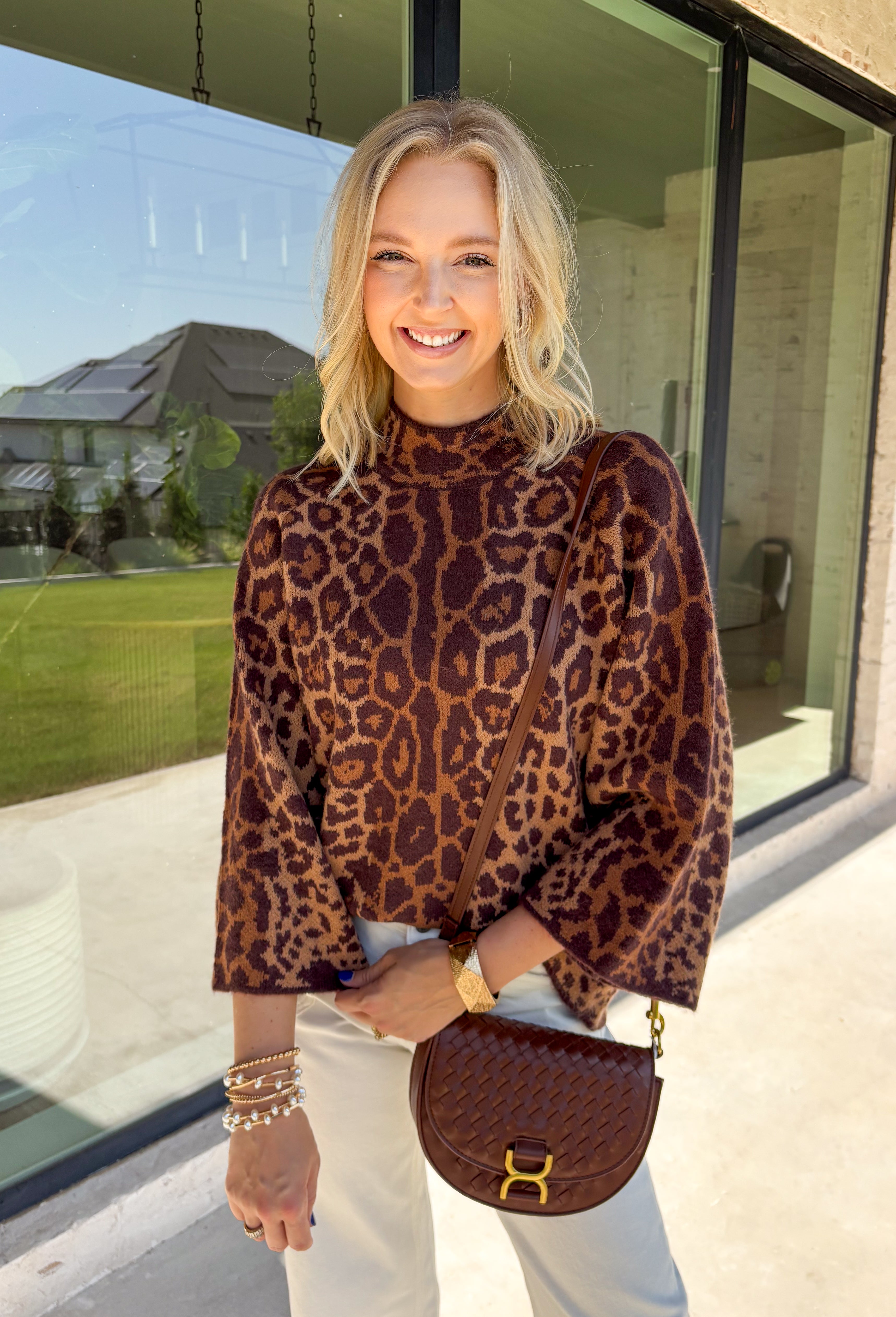 A timeless leopard print never goes out of style, and this cozy sweater is one you'll be reaching for all season long. Designed with a classic leopard pattern and an effortlessly chic mock neckline, this sweater combines bold style with everyday comfort. The ultra-soft knit feels cozy without being too heavy, making it perfect for layering through the cooler months. 