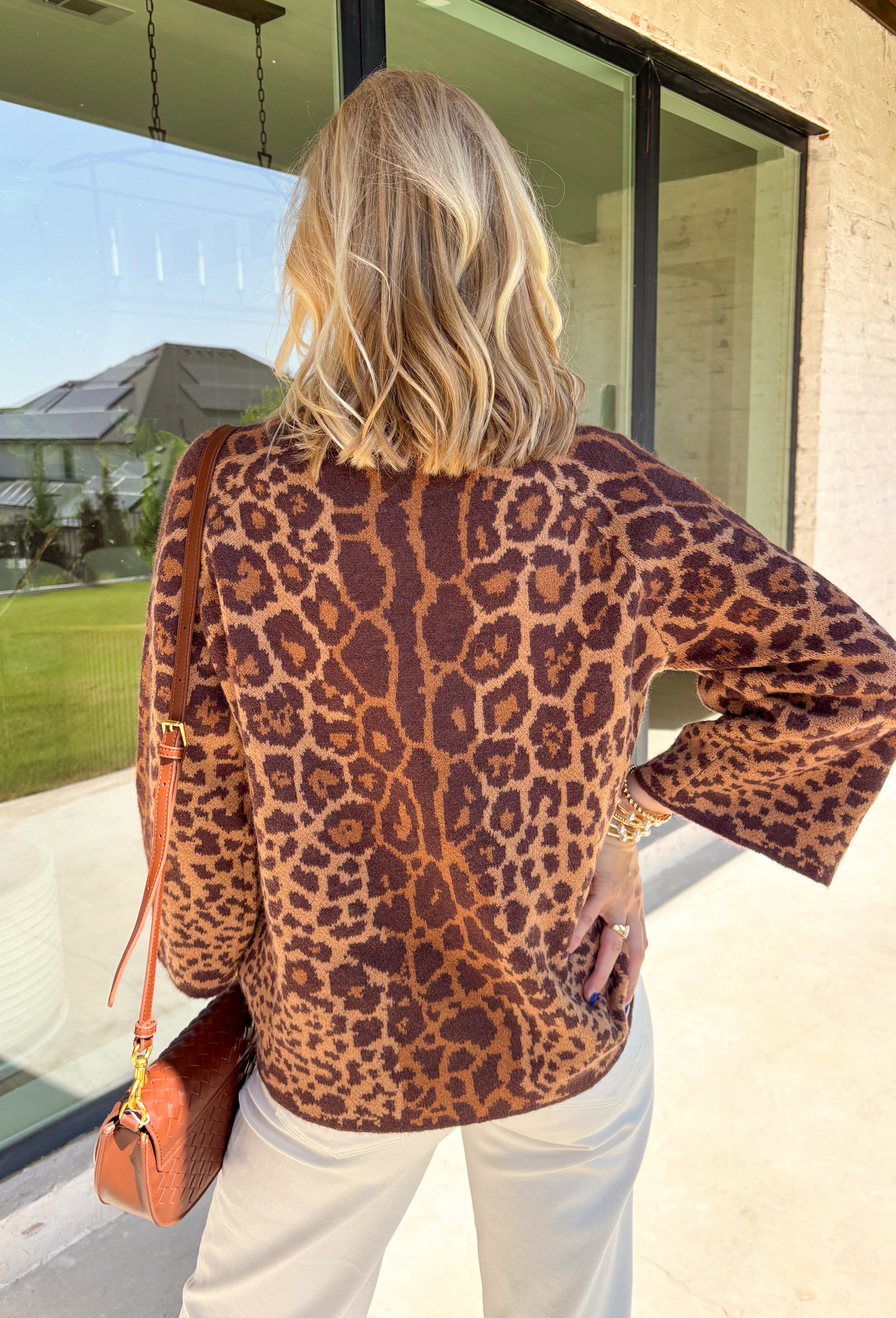 A timeless leopard print never goes out of style, and this cozy sweater is one you'll be reaching for all season long. Designed with a classic leopard pattern and an effortlessly chic mock neckline, this sweater combines bold style with everyday comfort. The ultra-soft knit feels cozy without being too heavy, making it perfect for layering through the cooler months. 