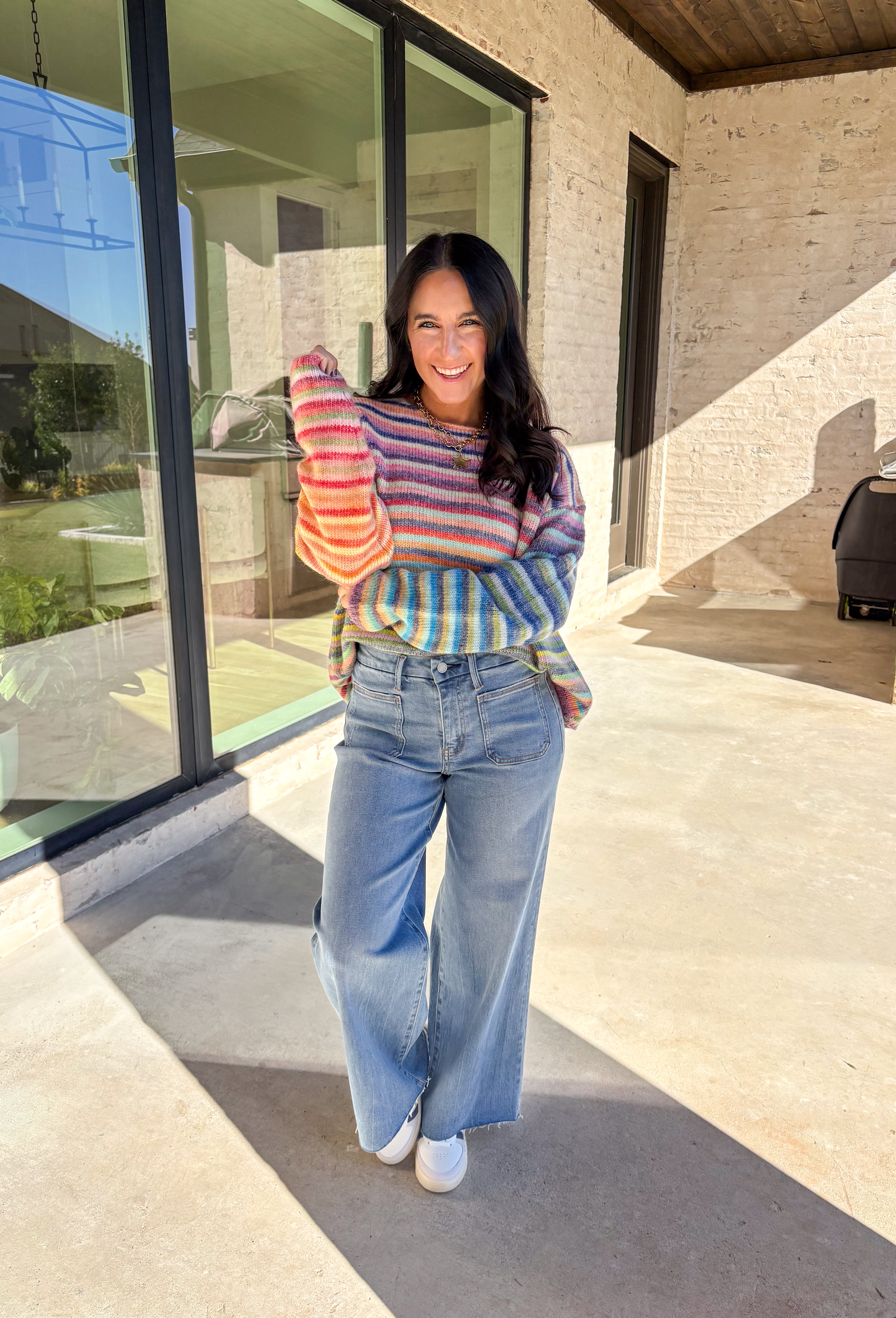 Brighten up chilly days with this cozy stripe knit sweater. Designed in a rainbow of cheerful colors, it’s a fun, feel-good piece that brings instant personality to your wardrobe. The soft knit blend keeps it warm and comfortable, while the relaxed fit makes it perfect for layering with your favorite jeans or skirts. Playful yet versatile, this sweater is the kind of statement piece you’ll wear on repeat all season long.