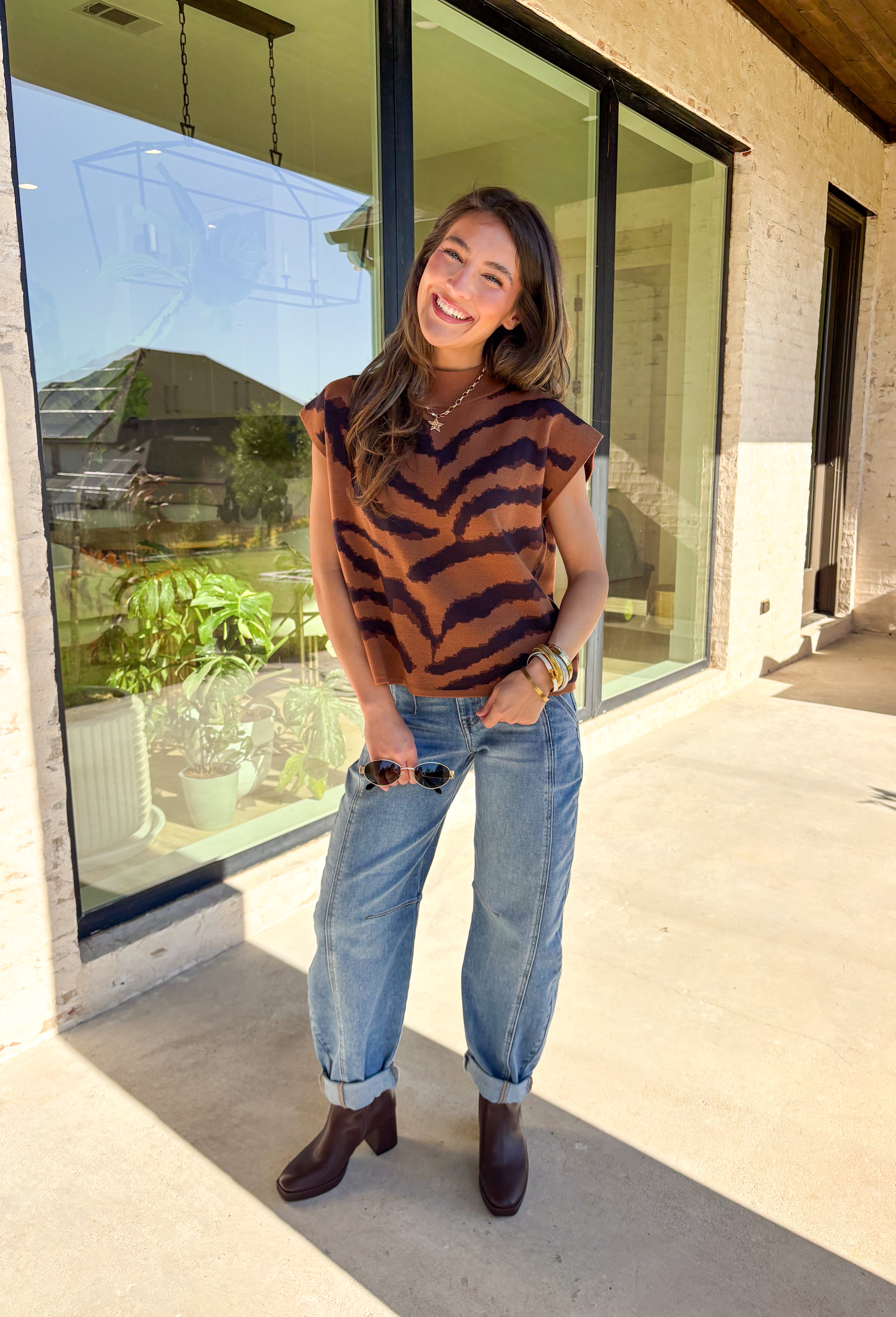 A little wild, a lot cozy—this camel short sleeve sweater is the perfect blend of chic and playful. Designed with a bold tiger stripe print, it features a mock neckline and a relaxed silhouette for easy, comfortable wear. This sweater is a versatile piece that can be styled for both casual days and polished evenings.