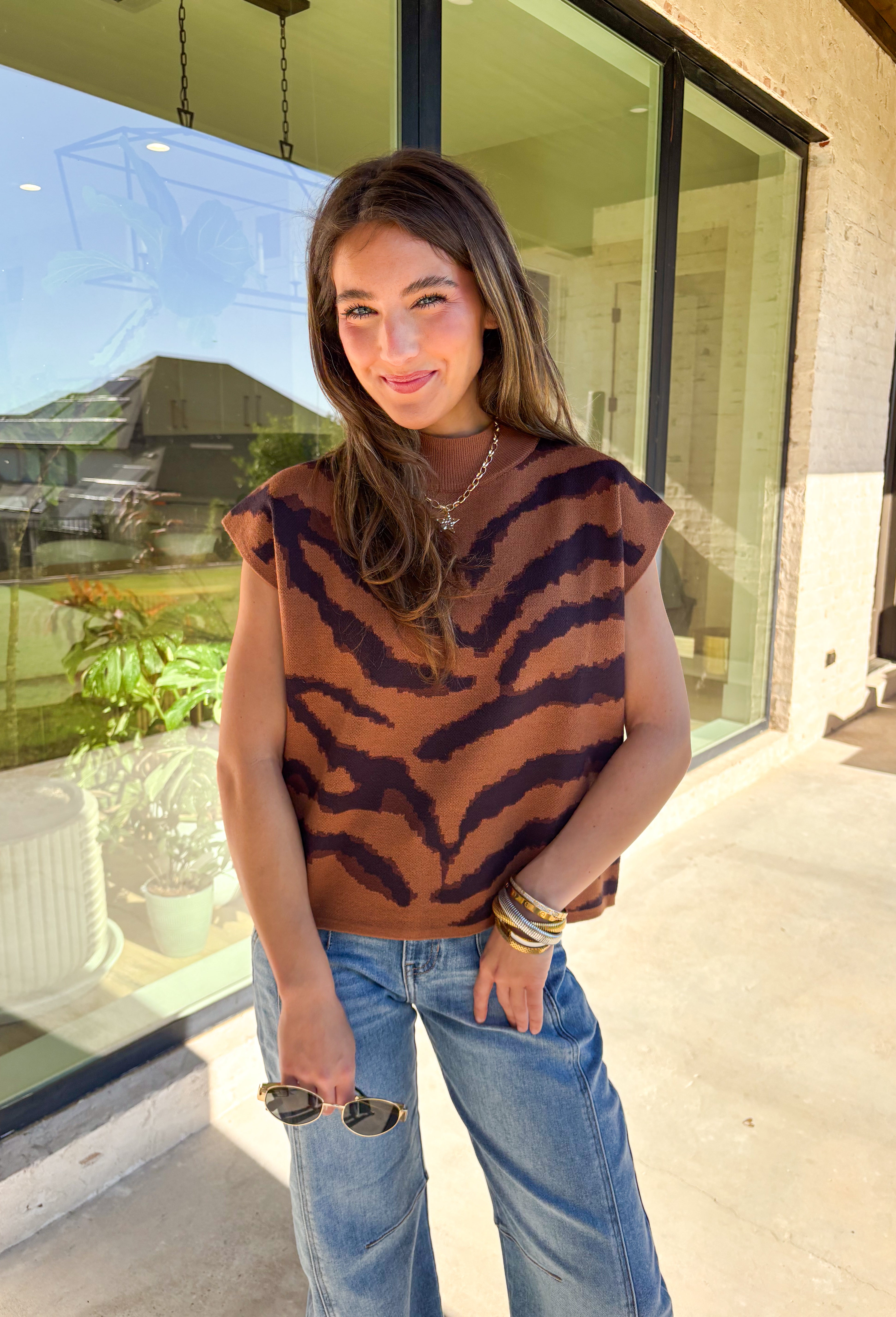 A little wild, a lot cozy—this camel short sleeve sweater is the perfect blend of chic and playful. Designed with a bold tiger stripe print, it features a mock neckline and a relaxed silhouette for easy, comfortable wear. This sweater is a versatile piece that can be styled for both casual days and polished evenings.