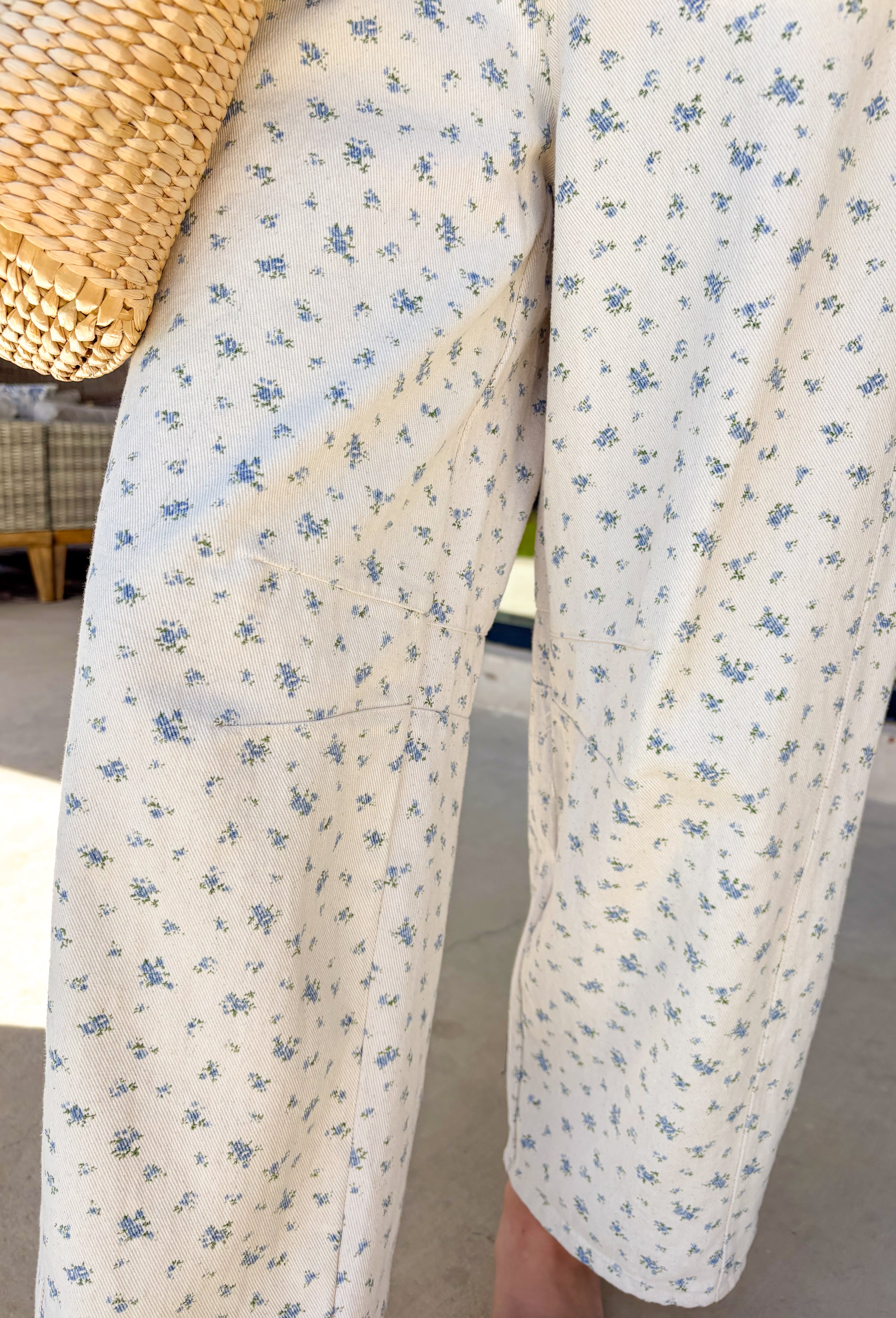 A fresh twist on your favorite relaxed denim! These neutral barrel jeans feature the sweetest dainty blue floral print throughout, giving them a soft, feminine feel while still keeping that laid-back, on-trend silhouette. The barrel leg shape creates a modern, slightly tapered look that feels both comfortable and stylish. An elastic back waistband adds a touch of stretch for an easy fit, while the cotton denim keeps them structured and breathable. They’re the perfect mix of playful and effortless.