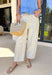 A fresh twist on your favorite relaxed denim! These neutral barrel jeans feature the sweetest dainty blue floral print throughout, giving them a soft, feminine feel while still keeping that laid-back, on-trend silhouette. The barrel leg shape creates a modern, slightly tapered look that feels both comfortable and stylish. An elastic back waistband adds a touch of stretch for an easy fit, while the cotton denim keeps them structured and breathable. They’re the perfect mix of playful and effortless.