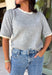 This grey short sleeve sweater is the perfect blend of cozy and classic for the fall season! The soft knit is beautifully finished with ivory scalloped trim along the neckline and sleeves, creating the look of an effortlessly layered outfit without any extra bulk. Its timeless silhouette makes it easy to style for work, weekend outings, or dinner with friends, while the lightweight knit is perfect for those crisp autumn days. 