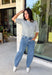 This grey short sleeve sweater is the perfect blend of cozy and classic for the fall season! The soft knit is beautifully finished with ivory scalloped trim along the neckline and sleeves, creating the look of an effortlessly layered outfit without any extra bulk. Its timeless silhouette makes it easy to style for work, weekend outings, or dinner with friends, while the lightweight knit is perfect for those crisp autumn days. 
