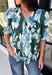 Bring a fresh take on fall florals to your wardrobe with this beautiful hunter green top. Featuring a delicate blue and off white floral print, this timeless top is perfect for everything from office days to weekend outings. The pintuck detailing along the front adds an elevated touch, while the button front and short puff sleeves create a feminine silhouette you'll love season after season. 
