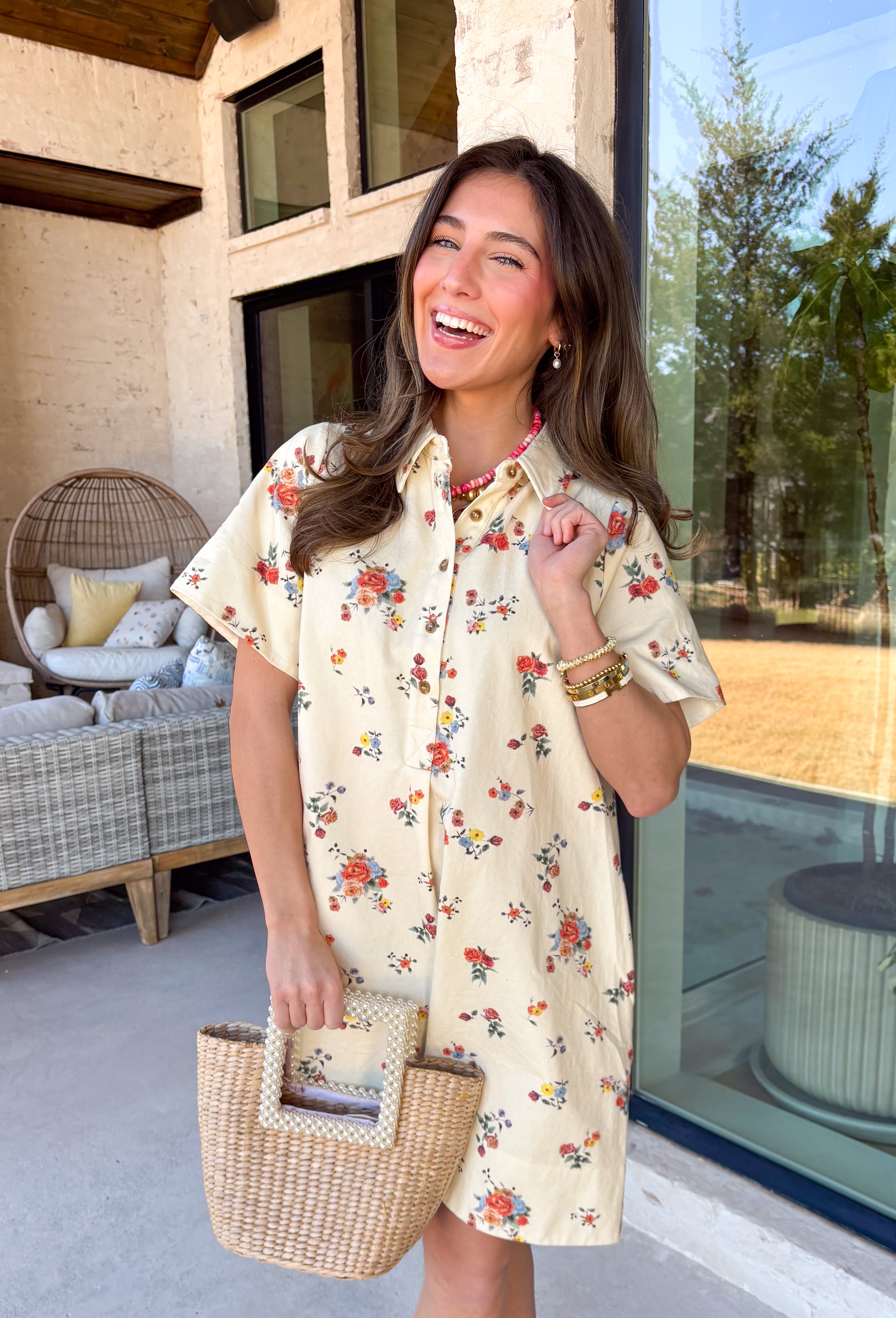 Fresh, fun, and full of spring color, this cream denim dress is an easy standout for the season. Featuring a colorful floral print throughout in shades of red, yellow, blue, and green, it brings a cheerful pop to a classic denim silhouette. The collared neckline and front button details keep it timeless and polished, while side pockets add that everyday functionality we all love. Made from breathable cotton denim, this dress is perfect for spring days when you want something effortless but still eye-catchin