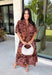 Warm fall color takes center stage in this terra cotta floral midi dress from Entro. Covered in a beautiful floral print featuring shades of the season, it has an autumn-ready look that works for everything from family photos to weekend gatherings. The v-neckline and button-front closure keep the silhouette classic, while short puff sleeves add a sweet touch of volume.