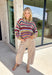 Wrap yourself in all the beautiful colors of the season with this cozy striped sweater. Featuring a gorgeous mix of green, off white, rust, blue, brown, purple, and yellow, this soft knit brings warmth, personality, and effortless style to your everyday wardrobe. The relaxed silhouette makes it perfect for layering on crisp fall mornings or cozy evenings, while the colorful stripes make it an easy statement piece you'll love wearing year after year. 