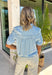 Meet your new spring staple. This lightweight chambray button down is the definition of easy, effortless style. Crafted from ultra-soft tencel, it has that perfectly broken-in feel from the very first wear—light, breathable, and ideal for sunny days ahead. Soft gathered shirring across the yoke adds a subtle feminine touch while creating a flowy silhouette that drapes beautifully without clinging. 