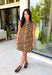 Make a statement this season with this effortlessly chic denim zebra print dress. Designed in a rich brown hue with a timeless zebra print, this sleeveless style is the perfect blend of bold and sophisticated. The shoulder detailing adds a modern touch, while the structured silhouette creates an effortlessly polished look.