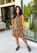 Make a statement this season with this effortlessly chic denim zebra print dress. Designed in a rich brown hue with a timeless zebra print, this sleeveless style is the perfect blend of bold and sophisticated. The shoulder detailing adds a modern touch, while the structured silhouette creates an effortlessly polished look.