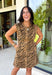 Make a statement this season with this effortlessly chic denim zebra print dress. Designed in a rich brown hue with a timeless zebra print, this sleeveless style is the perfect blend of bold and sophisticated. The shoulder detailing adds a modern touch, while the structured silhouette creates an effortlessly polished look.