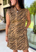 Make a statement this season with this effortlessly chic denim zebra print dress. Designed in a rich brown hue with a timeless zebra print, this sleeveless style is the perfect blend of bold and sophisticated. The shoulder detailing adds a modern touch, while the structured silhouette creates an effortlessly polished look.
