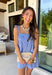This light blue eyelet lace set is the definition of a dreamy summer outfit! The delicate eyelet detail paired with scalloped hems gives it that soft, feminine feel, while the matching set makes getting dressed effortless. The sleeveless top features smocking along the front and adjustable tie straps for the perfect fit, and the elastic waist shorts keep things comfortable for all-day wear. Lightweight and breathable in 100% cotton, it’s perfect for everything from vacation mornings to casual days out
