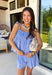 This light blue eyelet lace set is the definition of a dreamy summer outfit! The delicate eyelet detail paired with scalloped hems gives it that soft, feminine feel, while the matching set makes getting dressed effortless. The sleeveless top features smocking along the front and adjustable tie straps for the perfect fit, and the elastic waist shorts keep things comfortable for all-day wear. Lightweight and breathable in 100% cotton, it’s perfect for everything from vacation mornings to casual days out