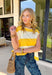 This sleeveless off white and yellow striped top by Wishlist is the perfect little piece to brighten up your spring wardrobe! The bold stripe pattern feels fresh and cheerful, and the sleeveless cut makes it an easy grab for warm days, weekend plans, or layering under a light jacket when the mornings are still a little chilly. Lightweight and easy to style, this top pairs perfectly with denim shorts, white jeans, or a cute skirt for a simple outfit that still feels fun and put-together. 