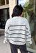 Cozy up in timeless style with this beautiful cardigan from Hyfve. Designed in a soft light gray knit with classic black and cream stripes, this button-down sweater is the perfect layering piece for the season. Ribbed detailing throughout adds texture and a polished finish, while the ultra-soft knit blend keeps you warm and comfortable without feeling bulky. Whether you wear it buttoned as a sweater or layered over your favorite basics, this versatile cardigan is one you'll reach for again and again.