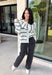 Cozy up in timeless style with this beautiful cardigan from Hyfve. Designed in a soft light gray knit with classic black and cream stripes, this button-down sweater is the perfect layering piece for the season. Ribbed detailing throughout adds texture and a polished finish, while the ultra-soft knit blend keeps you warm and comfortable without feeling bulky. Whether you wear it buttoned as a sweater or layered over your favorite basics, this versatile cardigan is one you'll reach for again and again.