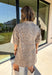 Take a walk on the playful side of fall with this mocha denim dress from New In. The warm mocha shade is covered in an ivory fawn-inspired spotted print, giving classic denim an unexpected woodland twist that’s perfect for the season. A collared neckline and front button closure keep the silhouette classic, while short sleeves make it a great pick for warmer autumn afternoons. Front pockets add a casual, functional touch and complement the denim construction.
