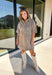 Take a walk on the playful side of fall with this mocha denim dress from New In. The warm mocha shade is covered in an ivory fawn-inspired spotted print, giving classic denim an unexpected woodland twist that’s perfect for the season. A collared neckline and front button closure keep the silhouette classic, while short sleeves make it a great pick for warmer autumn afternoons. Front pockets add a casual, functional touch and complement the denim construction.