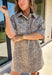 Take a walk on the playful side of fall with this mocha denim dress from New In. The warm mocha shade is covered in an ivory fawn-inspired spotted print, giving classic denim an unexpected woodland twist that’s perfect for the season. A collared neckline and front button closure keep the silhouette classic, while short sleeves make it a great pick for warmer autumn afternoons. Front pockets add a casual, functional touch and complement the denim construction.