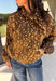 Give your fall layers a little personality with this brown animal print jacket from Entro. The neutral color palette makes the statement print surprisingly easy to mix into your everyday wardrobe, whether you're heading to lunch, running errands, or spending a Saturday out and about. A zipper closure keeps the silhouette casual, while the tie detail at the neckline adds a fun finishing touch.