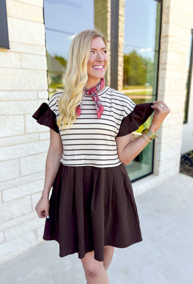 All Together Again Dress, brown denim mini dress with cream and brown striped body, flutter sleeves, pleating on the bottom half of the dress, pockets 