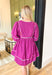 Austin Nights Dress, fuchsia blousy quarter sleeve v-neck mini dress with multi-colored hemming on the hems, cinching of the sleeves, neckline, tier of the dress, and across the chest 