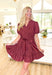 Autumn Charm Dress in Red Brown, burgundy puff sleeve tiered mini dress with v-neck, pockets, and tie belt detail 