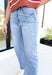 Ava Super High Rise Barrel Denim by Flying Monkey, light wash barrel jeans with light distressing under the right pocket and frayed hems on the ankles 